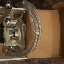 BRAND NEW. Bathroom basin mixer tap complete with 2 flexi pipes and pop up waste kit.