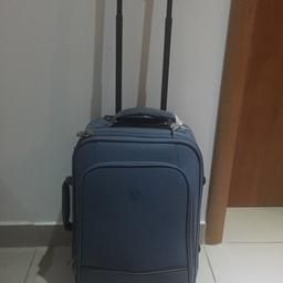 Light blue hand luggage with padlock.