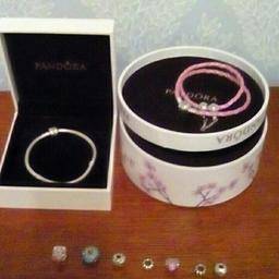 Two Pandora bracelets only warn a few times with boxes and charms pick up only back on due to time waster