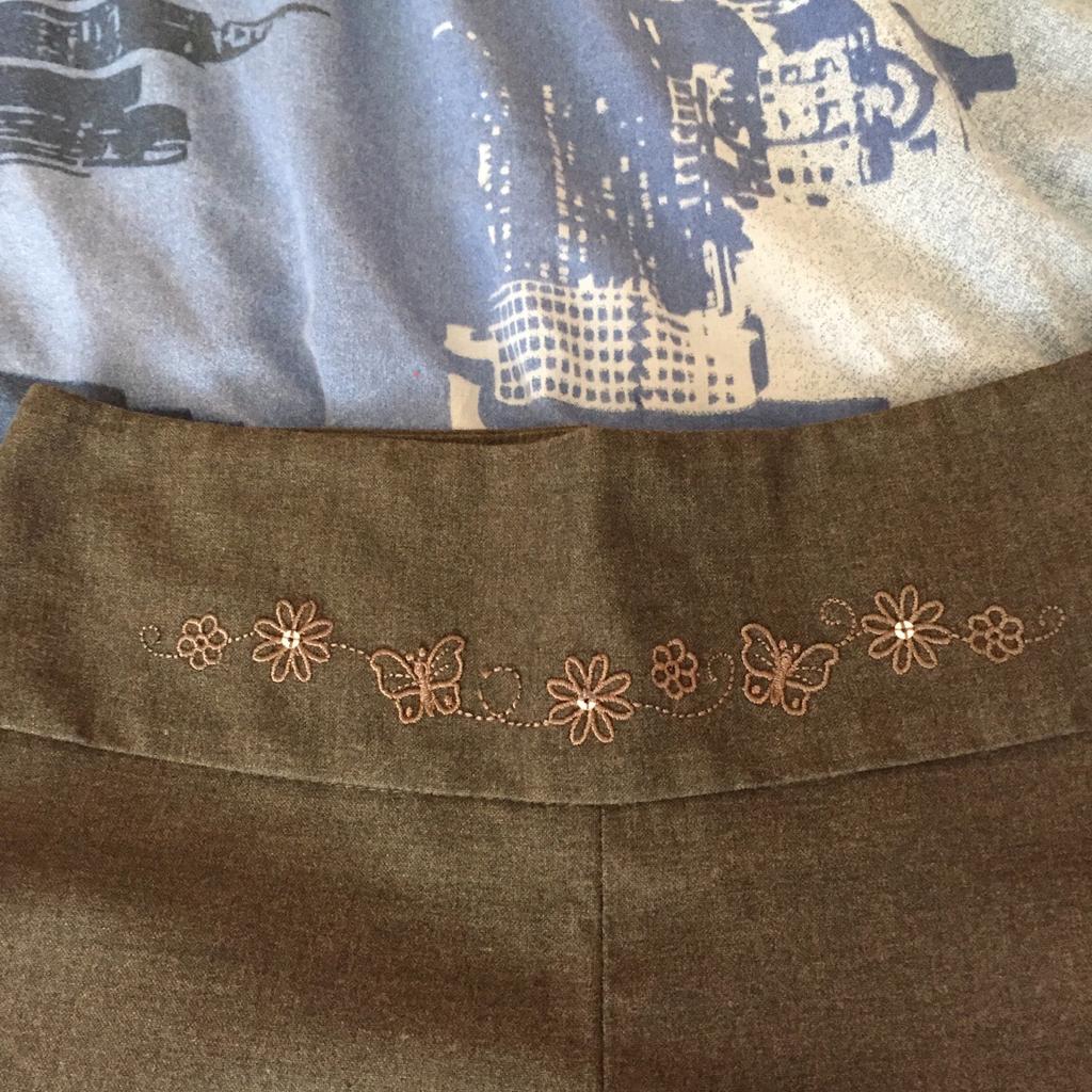 Almost new grey girls trousers with flower & butterfly detail on the waist band. I have two pairs but can be sold separately. These are from Asda. Collection only ( fishponds) These have been relisted twice.