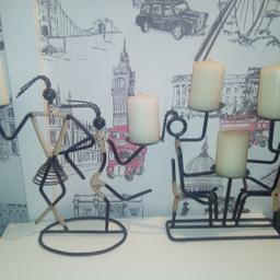 Pair of Egyptian / matchstick man style metal candlesticks, including candles. 
Selling as a pair and will not split them.