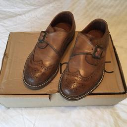 Leather boys shoes
Tan in colour 
Buckle fastening