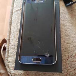 Samsung S6 edge ....screen is cracked at the bottom but it is barely visible when phone is on apart from the crack the phone is in mint condition and works mint