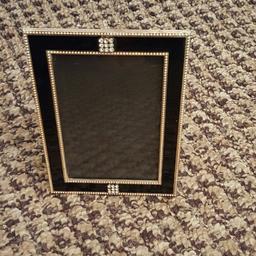 Black and silver picture frames in good condition open to offers