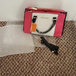 Michelle kors pink and black handbag never been used open to offers