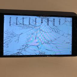 Cracked screen but works fine. 
No charger or headphones