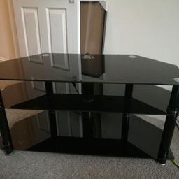 Lovely black glass tv stand. Very good condition. Will fit large tv.