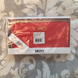 Brand new coral DKNY purse never been opened still in box with tags and plastic. RRP £90