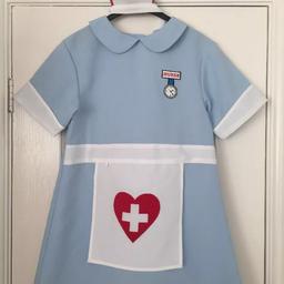 Superb alone nurses outfit that opens to the waist for easy putting on over other clothes. 
Well looked after & plenty of wear still in it.