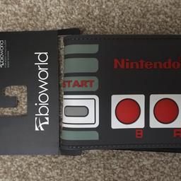 Nintendo wallet, new, never used. I have 15 of these from a business I'm closing.