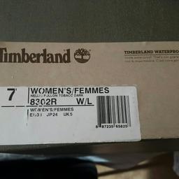 Brand new ladies boots still in box never worn right boot very minor mark see pic