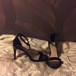 Black pair of heals worn only once.Fantastic bargain. Lovely on