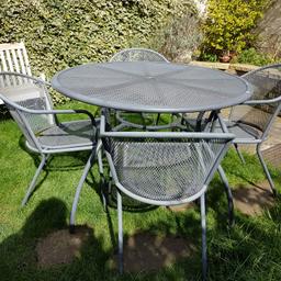 Grey metal garden table and chairs . Needs a good scrub. But good condition /sturdy