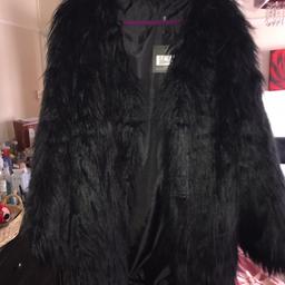 This size 14 stylish Black Chic coat is incredibly warm, Brought New With Tags on and very affordable! What's not to like! RRP £49.99. I'm selling due to being in bad health which I need to accommodate to x