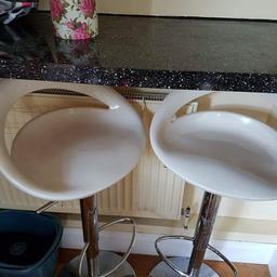 2 white plastic stools