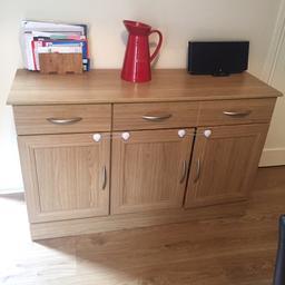 Large oak veneer sideboard. In great condition. Only selling due to move. (Shown here with childproofing- white locks)
Sideboard: 77cm H x 124cm W x 42cm D.