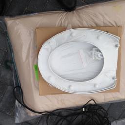 White - brand new white toilet seat - sealed