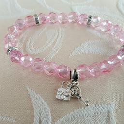 Very pretty pink bracelet with silver and diamontes with lock and key dropper. Brand new, comes in an organza pouch