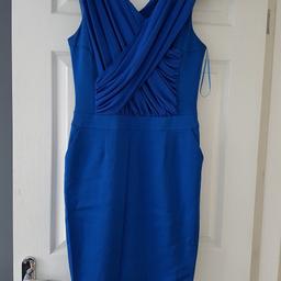 Lovely Reiss Crossover Dress. Size 12.
Used once for a wedding. On really REALLY close inspection a couple of faint marks.... barely visable on bottom of skirt. Welcome to view before confirming purchase. 100% wearable. Price reflects.
Zip back.
Stunning dress. Bargain. £190 new.