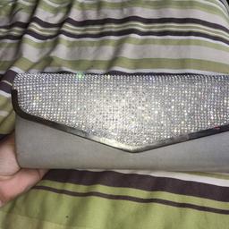 Diamonties clutch bag has an over the shoulder handle  used once for prom in good condition 15 Ono