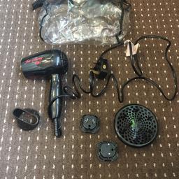 Hair dryer good working condition never really used it comes with extra parts and plugs and a bag £5