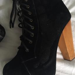Black, worn a couple times, all signs of wear shown size 7