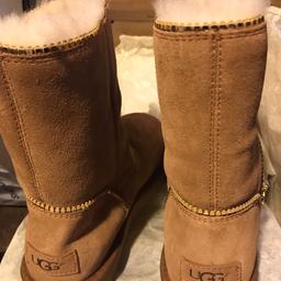 Size 5 tan ugg boots never worn, still boxed. Buyer to collect.