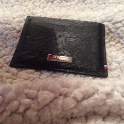 Black leather card holder will take 6 cards. Unwanted Gift