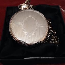 Nice pocket watch with chain needs. Battery never been used boxed