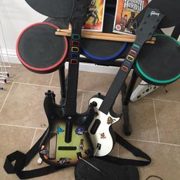 Guitar hero world tour including 2 games, drum kit, two guitars (one is missing the seal but still works perfect - picture showing this) extra PC guitar but no game