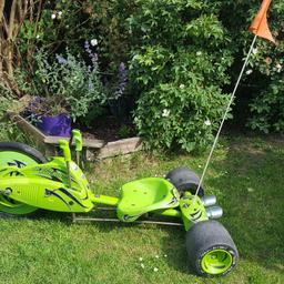 Kids greeen machine with adjustable seat.  Ideal for ages 5-10. Rust underneath but rides fine.  Can ride on grass also.  Ideal for summer fun!