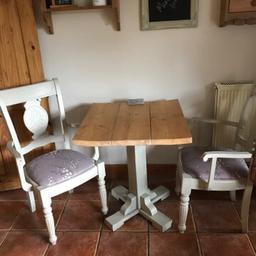 Lovely shabby chic table and two chairs. Seat pads can be removed if you wish to change the material. Lovely set no room in the new house for these forces sale.