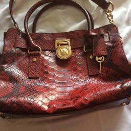 Medium sized bag, in red snake / croc print, magnetic closure.  In good preloved condition, metal ware has some tarnishing, loads of life left in it. comes with dustbag.  Will post for extra.