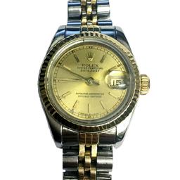 This model is a pre-owned ladies Rolex Datejust 69173 with a champagne dial and steel and 18ct Gold Jubilee bracelet with folding clasp. The watch features a date indicator and has a case size of 26mm. The bi-metal timepiece is powered by an automatic movement and is circa 1990's. A very popular watch amongst ladies. 

It is in fairly good condition with signs of wear and tear marks on the bracelet as expected of a watch from 1988. The luxury watch maintains good timing and would make ideal gift