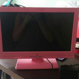 Great condition Cute pink Alba tv with stand and built in tv.No remote but can buy on eBay for under £12.