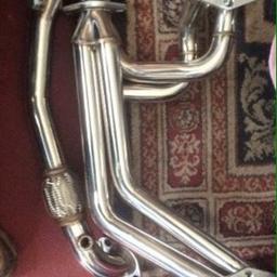 Stainless steel manifold including brand new up pipe , performance upgrade over standard was fitted for less that 7 days so has new , up pipe wasn't fitted at all so is new , any questions please ask , came off very early v1 wrx import 93- car picture for attention only Car NOT for sale