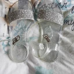 Lovely pair of girls next sliver glitter jelly sandals. Brand new never been worn. Has plastic tag attached. Size 2 collection only no offers