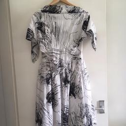 Great condition summer dress with matching head scarf. Just not my taste- was a gift