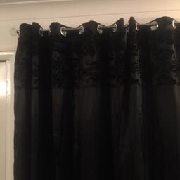 Black faux silk curtains with Damask pattern at the top. Ring tops and very good condition. 66inch wide and 72inch drop.