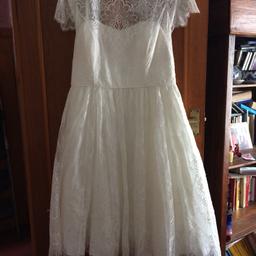 Brand new and unworn.
Still has tag on it and sample of lace.
This dress is tea dress length with some underskirting .
It has an open back with an arch of lace .
There is a small mark of foundation on the front ...should come out by dry cleaning.
Dress details at 450 new
Offers considered
