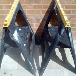 Heavy duty sawhorse, approx 32 inches high, open out to give tool shelve.