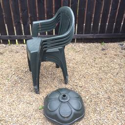 4 green outdoor garden chairs and base for a parasol . Chairs have little paint on them but probs come off