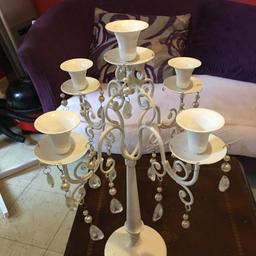 Hi I have for sale two beautiful white chandelier collection is woodgate area looks lovely on any sideboard comes with pink candles
