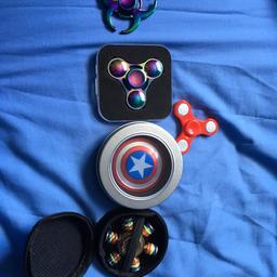 For sale is 4 fidget spinners the 3 sided oil slick spinner is £5 the captain America spinner is £5 the 6 sided spinner is £5 and the red spinner is £2 and the other rainbow spinner is £5message me if you want to buy.if you want to buy all of them it will be £15 as a deal.