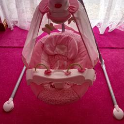 Lovely baby rocking chair swing can play all different music and can also rock on all different settings, it has lights and butterflies move around for the baby, also the front play thing can be removed and the canopy can to. best thing I Eva bought 4my little girl. rrp £170.00 good condition