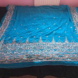 This colour is very fashionable right now. Pretty Sari worn once. Perfect for any party. Blouse included.