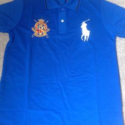 Blue polo shirt. New with tabs. Size Small/ medium.