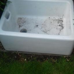 White ceramic butler sink used as a.garden feature.2ft long 11" high and 1ft 6" wide