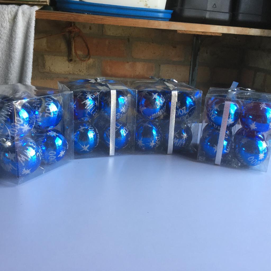 Millennium 2000 blue Christmas tree baubles (there are 32 baubles in total - 4 boxes each containing 8 baubles). Never been out of packaging. From smoke free and pet free (no dogs / cats) home. Cash on collection only from Bourne, PE10 please. Thanks for looking!