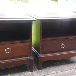 Dark mahogany bedside cabinets with a few scuffs and marks